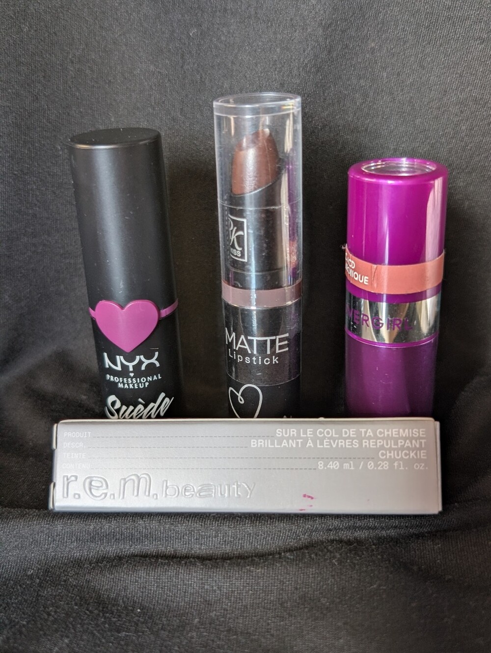 R.E.M. Ariana Grande-Chuckie, Nyx STFU, RK Dark Plum, CoverGirl-Amazing Petal